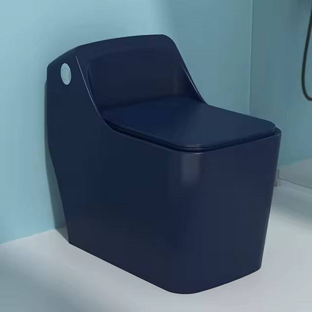 Modern dark blue toilet against a light blue wall