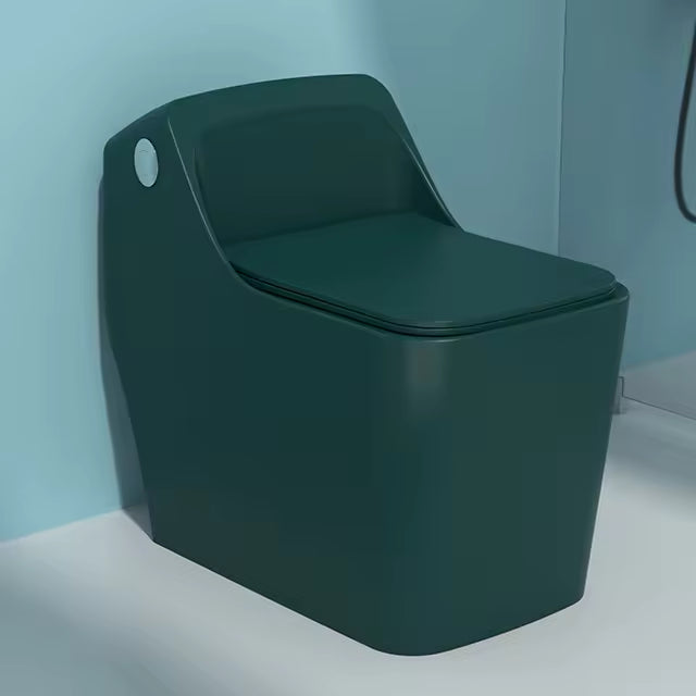 Green toilet against a light blue wall