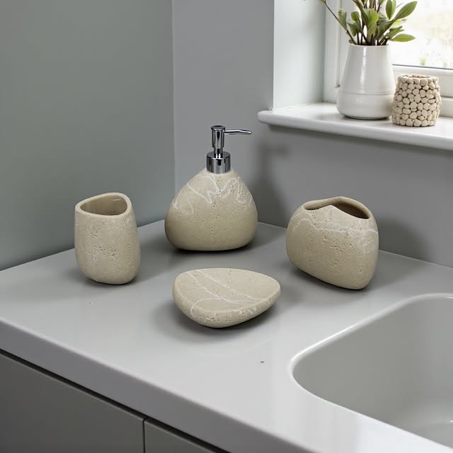 Bathroom set with textured ceramic items on a countertop.