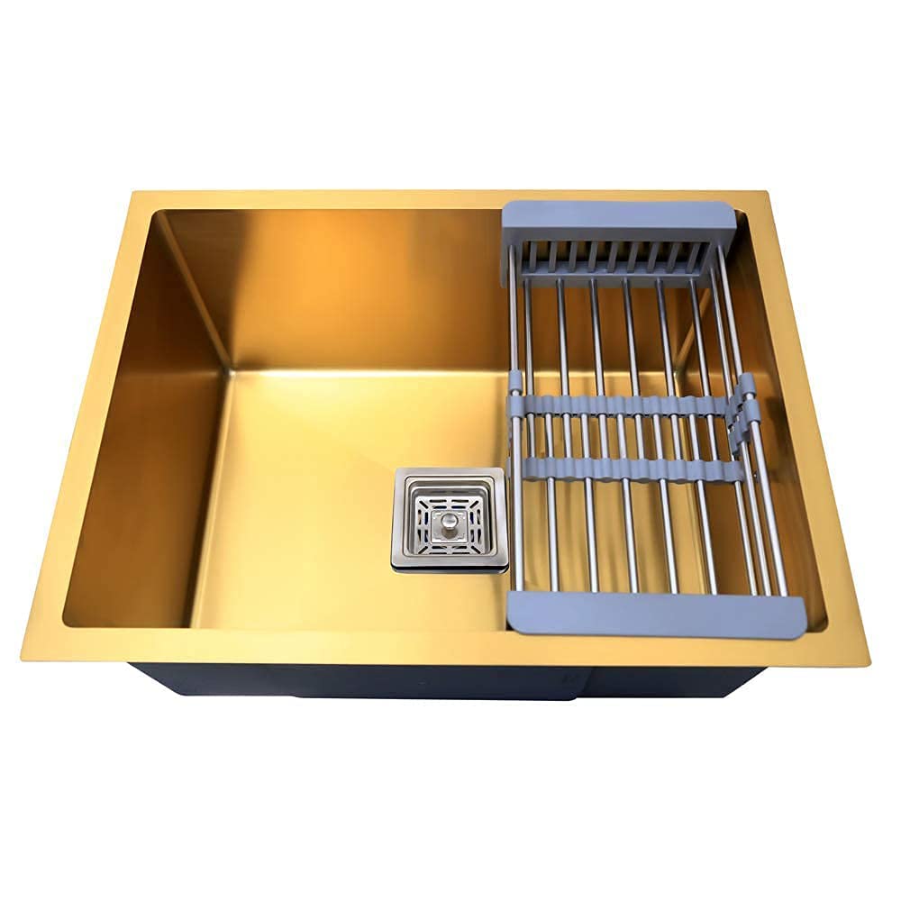 Gold-colored kitchen sink with a drain and dish rack on a white background