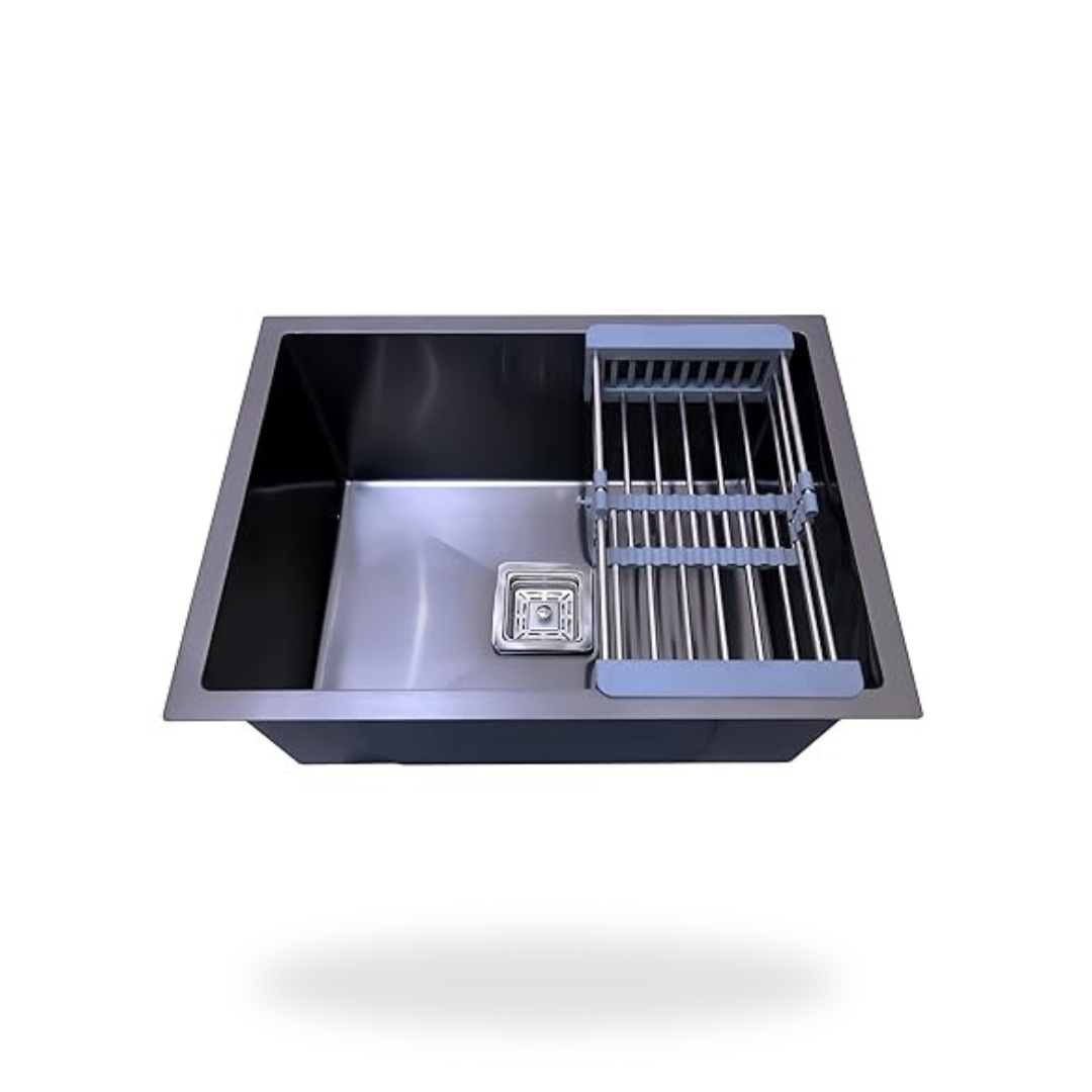 Stainless steel kitchen sink with drainboard on a white background