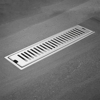 Metal floor drain cover on a concrete floor